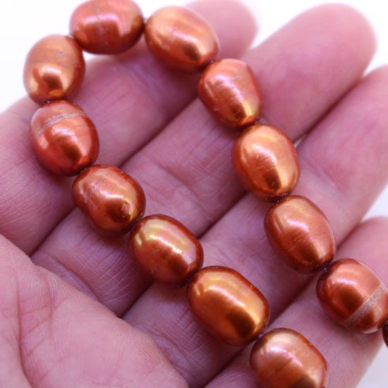 Wholesale Freshwater Pearls 10-12mm Rice Shape with Ring, Orange Color -15 inch strand
